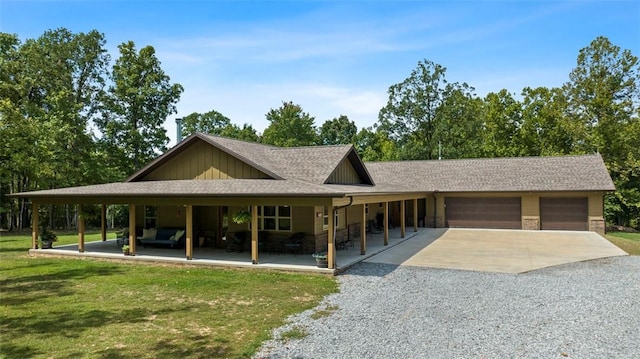 view of front of property featuring a shingled roof, concrete driveway, board and batten siding, a garage, and a front lawn