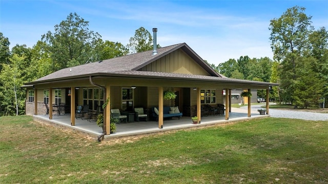 view of property's community featuring a patio area, outdoor lounge area, and a yard