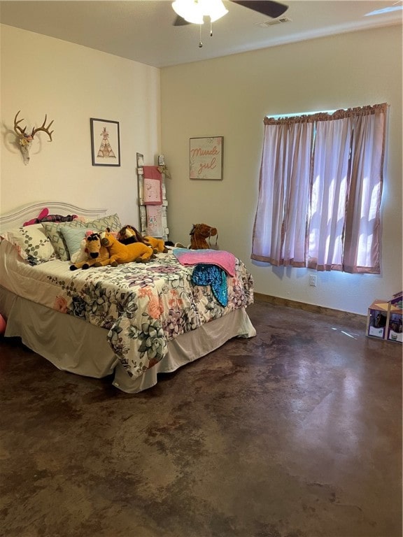 bedroom featuring ceiling fan and concrete floors