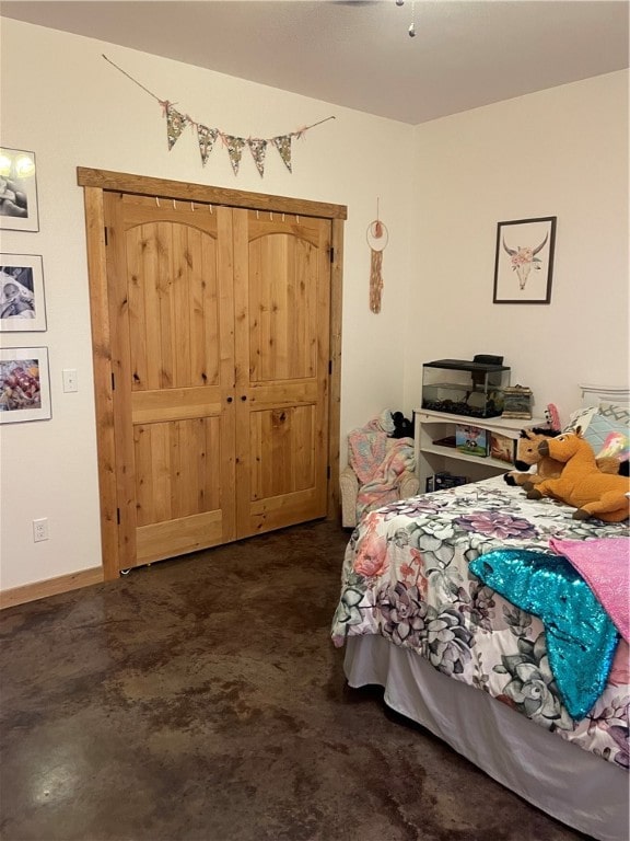 bedroom featuring concrete floors