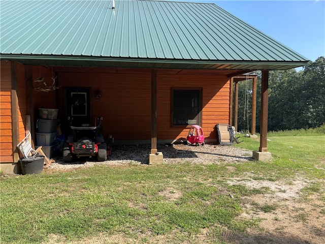 rear view of house with a lawn