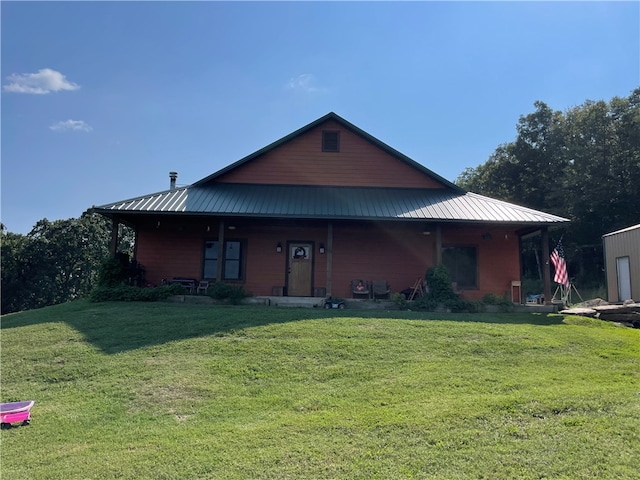 view of front of house with a front lawn and covered porch