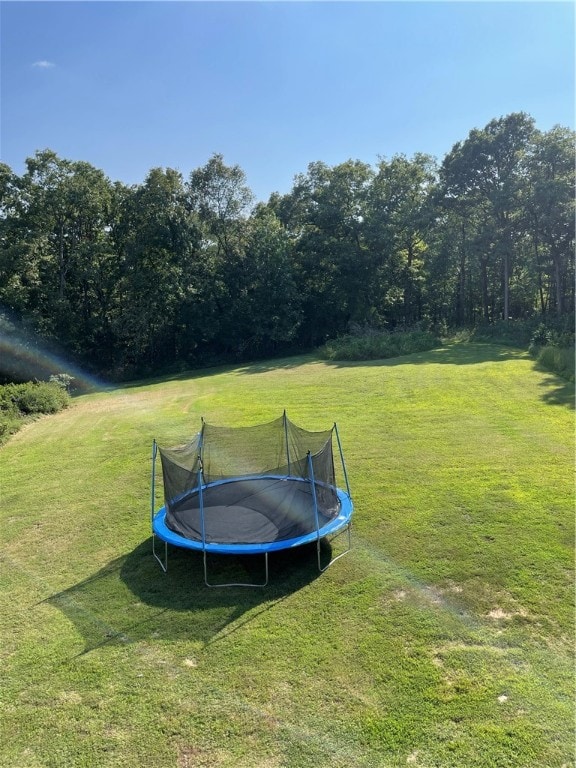 view of yard featuring a trampoline