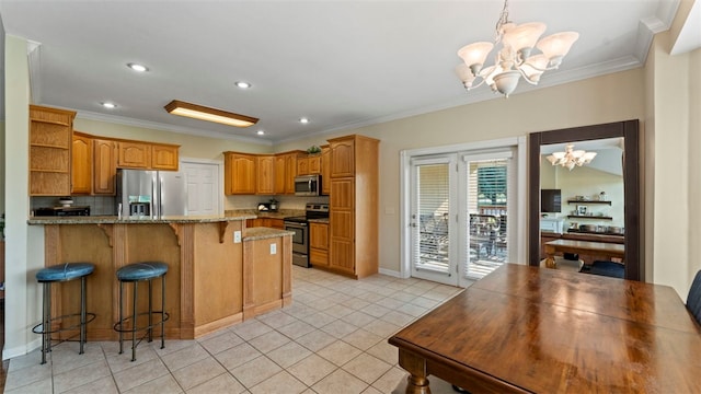 kitchen with crown molding, stainless steel appliances, an inviting chandelier, and light tile patterned floors