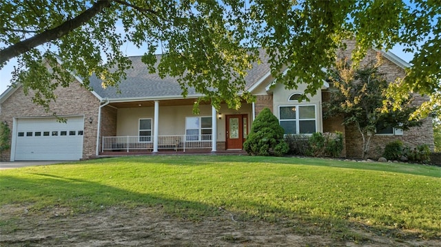 view of front facade featuring covered porch, a front yard, and a garage