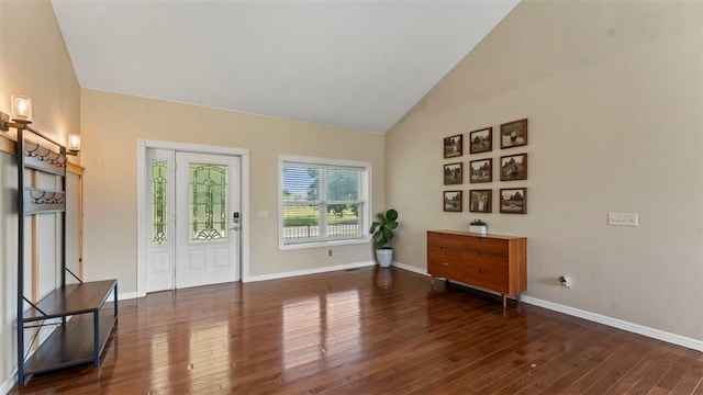 interior space with high vaulted ceiling and dark hardwood / wood-style floors