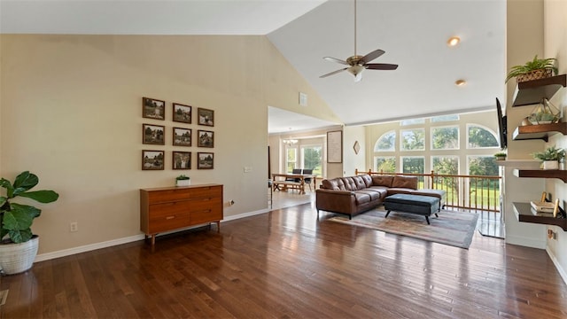 living room featuring dark wood-type flooring, ceiling fan, and high vaulted ceiling