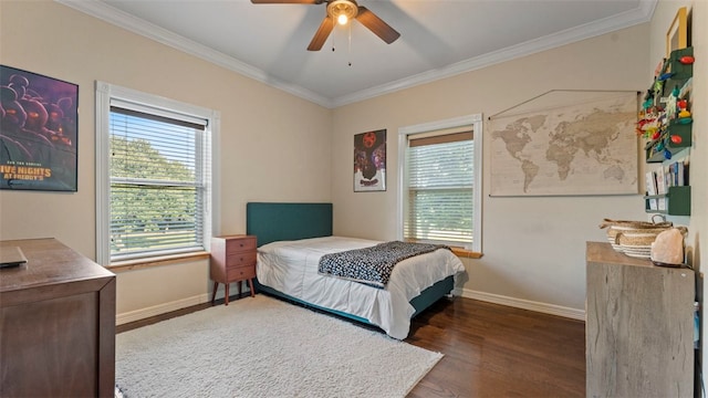 bedroom with crown molding, ceiling fan, and dark hardwood / wood-style flooring