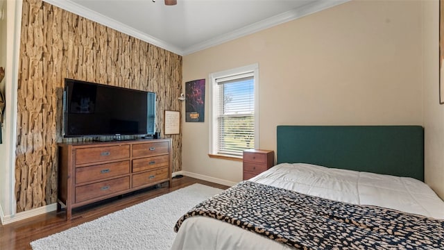 bedroom featuring ornamental molding, dark hardwood / wood-style flooring, and ceiling fan