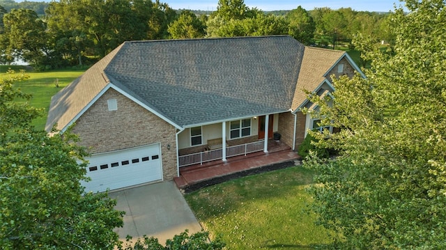 exterior space with a porch and a front lawn