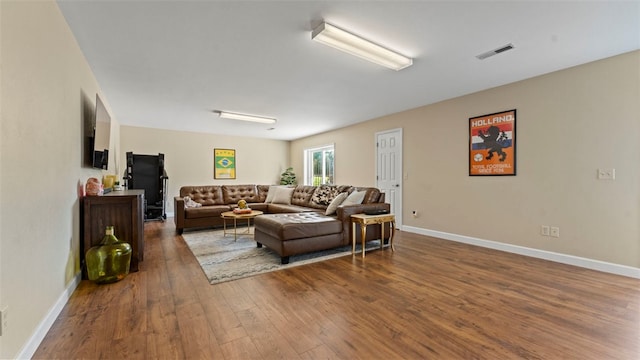 living room featuring dark wood-type flooring