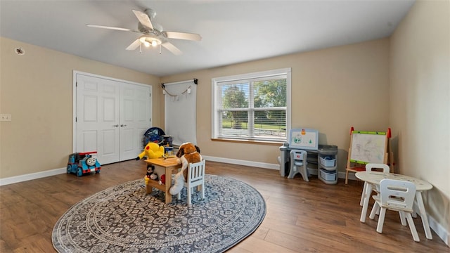 recreation room featuring wood-type flooring and ceiling fan