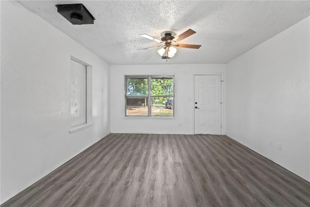 unfurnished room with a ceiling fan, a textured ceiling, and wood finished floors