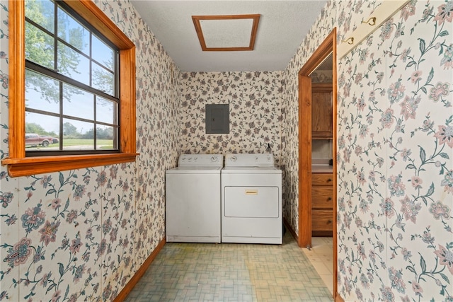 washroom featuring separate washer and dryer, a healthy amount of sunlight, and light tile patterned flooring