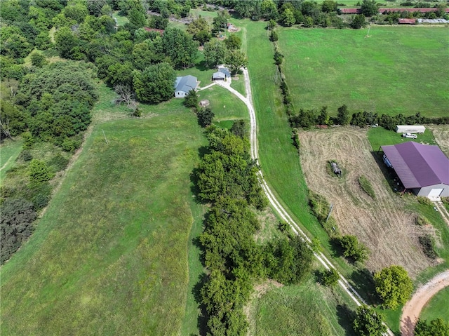 birds eye view of property featuring a rural view