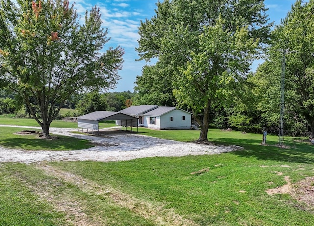 exterior space featuring a carport and a front lawn