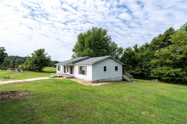 view of home's exterior with a lawn