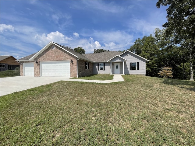 single story home featuring a front lawn and a garage