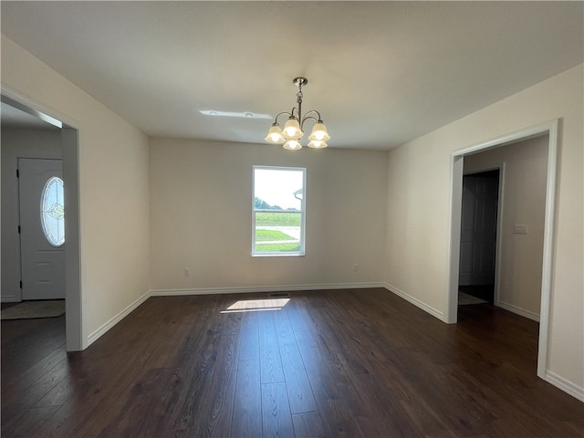 interior space featuring dark wood-type flooring and a notable chandelier