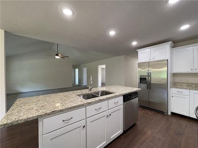 kitchen featuring stainless steel appliances, white cabinets, and sink