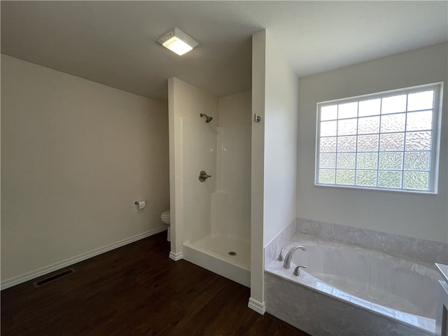 bathroom with toilet, separate shower and tub, and wood-type flooring