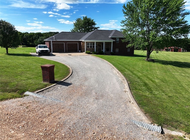 single story home with a garage and a front lawn