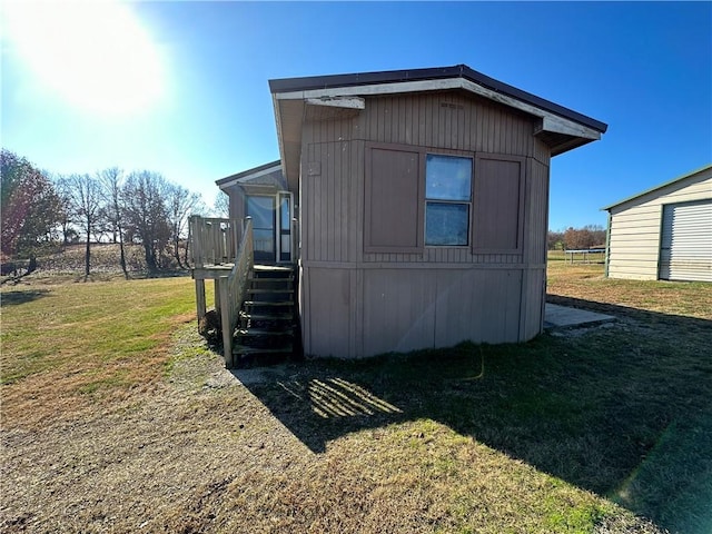 42 County Road 640, Green Forest, AR 72638 - view of home's exterior with a wooden deck, stairway, and a yard