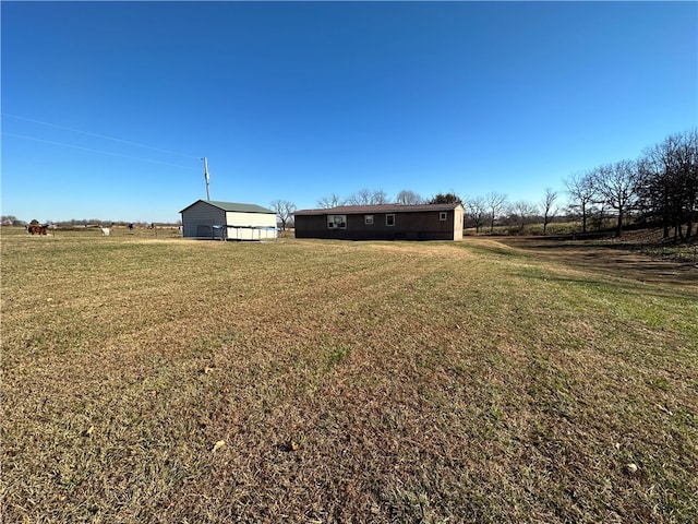 view of yard with a rural view