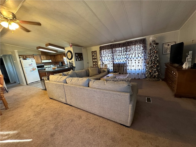 living room featuring light colored carpet and ceiling fan