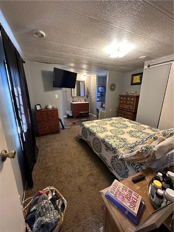 42 County Road 640, Green Forest, AR 72638 - bedroom with carpet floors, a textured ceiling, and visible vents
