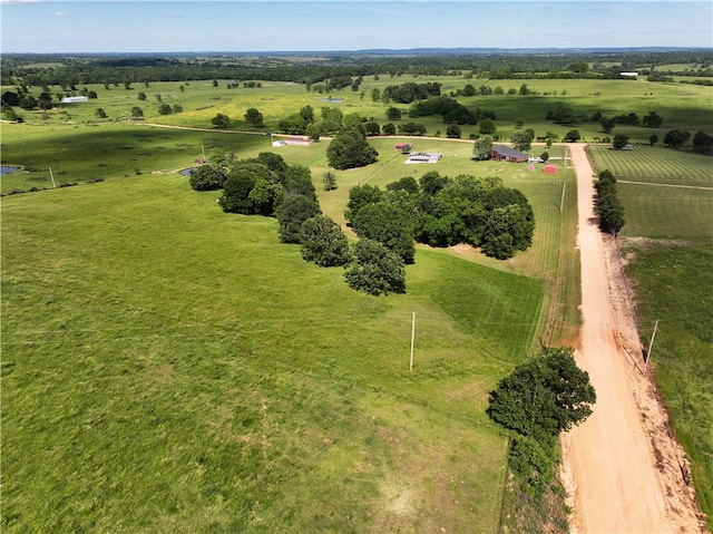 birds eye view of property featuring a rural view