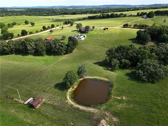 drone / aerial view featuring a rural view and a water view