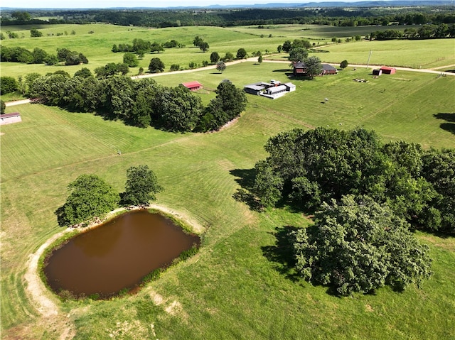 birds eye view of property with a rural view and a water view