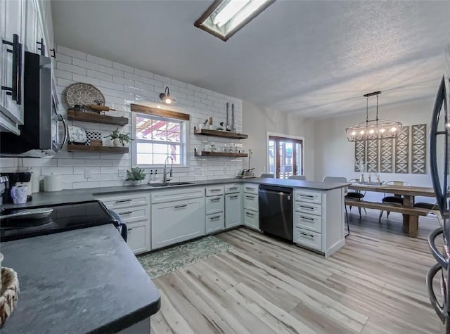 42 County Road 640, Green Forest, AR 72638 - kitchen featuring a peninsula, dishwasher, dark countertops, a sink, and open shelves
