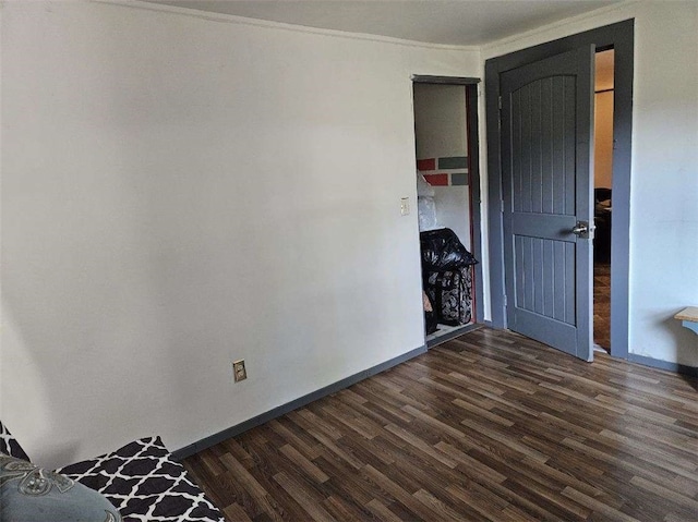 unfurnished bedroom featuring dark wood-type flooring