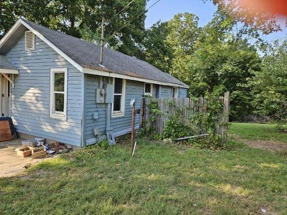 exterior space featuring a lawn