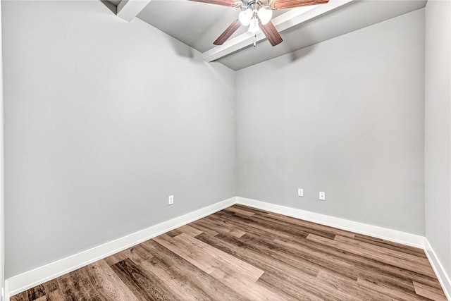 empty room with hardwood / wood-style floors and ceiling fan