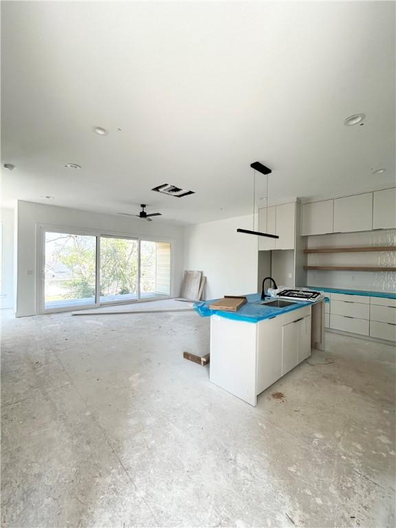 200 NW 9th St, Bentonville, AR 72712 - kitchen with a sink, visible vents, ceiling fan, white cabinetry, and modern cabinets