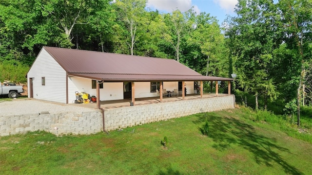 exterior space with a front yard and a porch