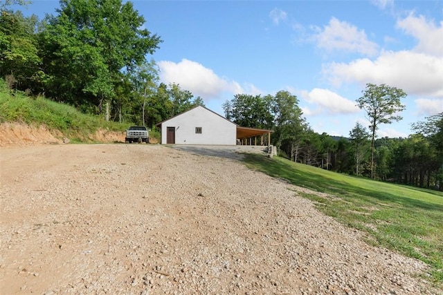 exterior space with a carport