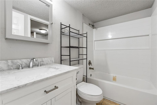 full bathroom with washtub / shower combination, tile patterned floors, a textured ceiling, toilet, and vanity