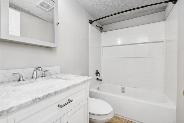 full bathroom featuring vanity, a textured ceiling, toilet, and shower / bathtub combination