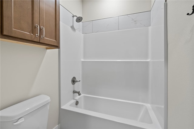 bathroom featuring toilet and bathing tub / shower combination