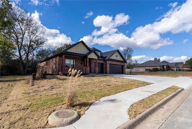 view of front of house with a garage and a front lawn