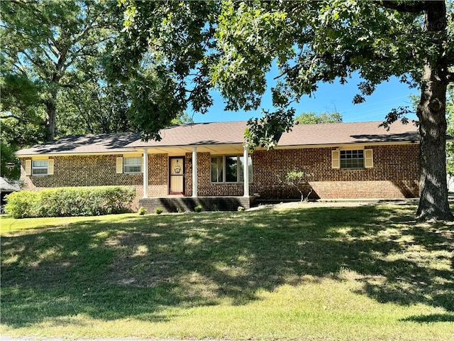 ranch-style house with brick siding and a front yard