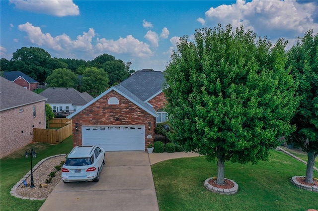 view of front facade featuring a garage and a front yard