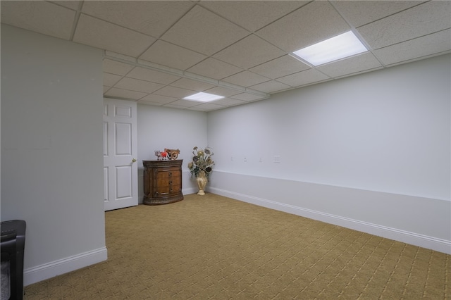 basement with carpet and a drop ceiling