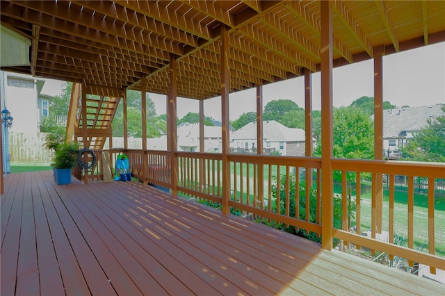 wooden deck with a lawn