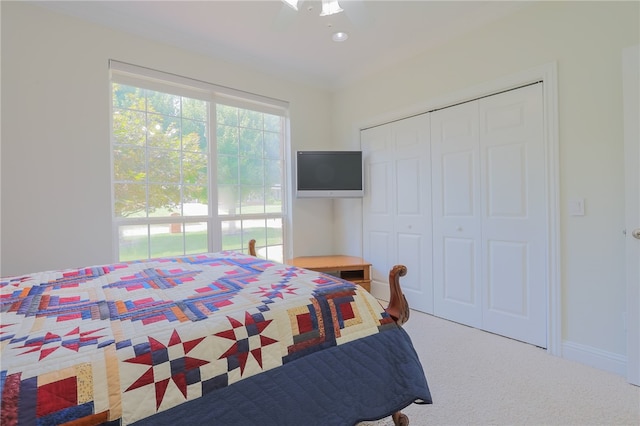 bedroom featuring a closet, carpet, and ceiling fan