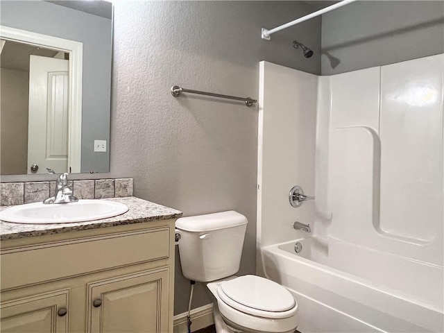 full bathroom with toilet, a textured wall, bathtub / shower combination, and vanity